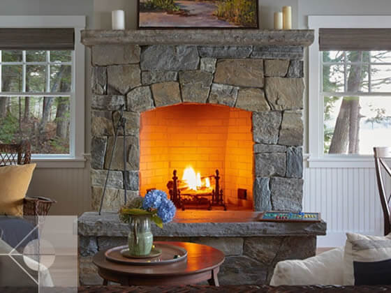 Stone fireplace with mantle.