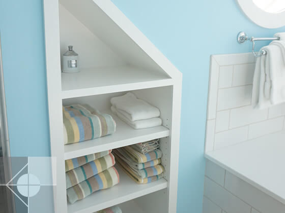 Bathroom nook with shelving.