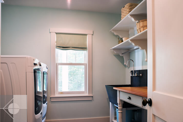 Laundry room with farmhouse sink.