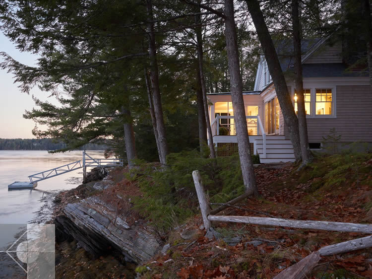 Evening view of cottage in Edgecomb, Maine by Phelps Architects