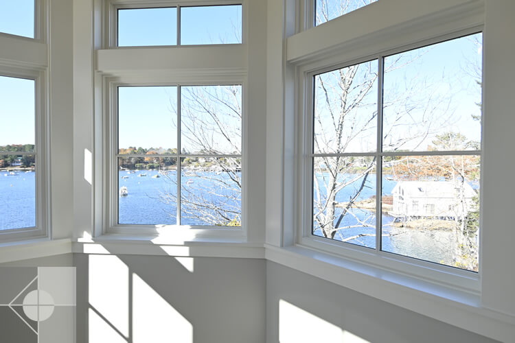 Link to an image of windows in the Round Pond Harbor home designed by Phelps Architects.