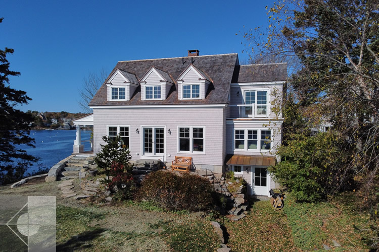 Link to an exterior image of the Round Pond Harbor home designed by Phelps Architects.