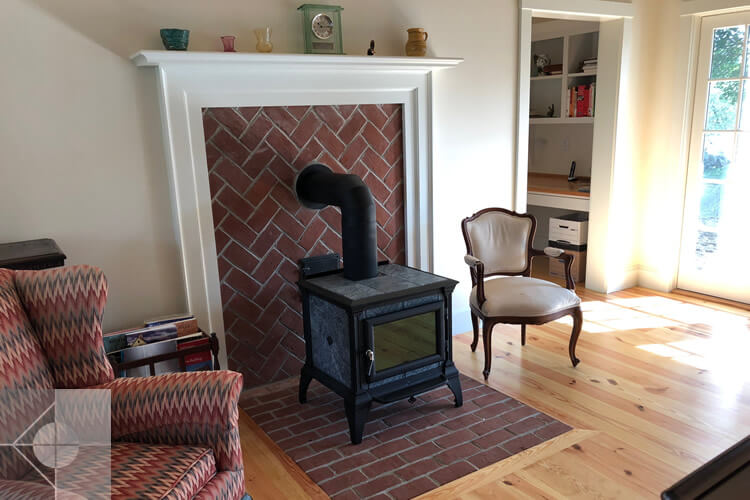 Living room historic renovation of a Newcastle, Maine house by Phelps Architects.