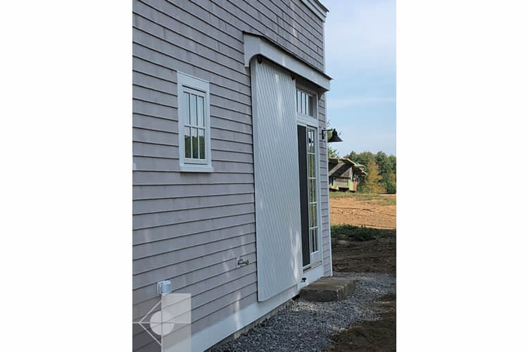 Historic exterior renovation of a Newcastle, Maine house by Phelps Architects.