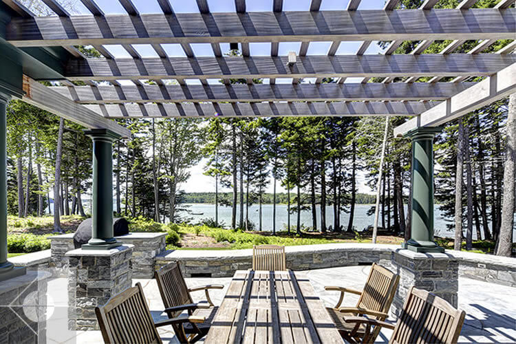 Landscape design featuring a pergola, sweeping terrace and outside eating area.