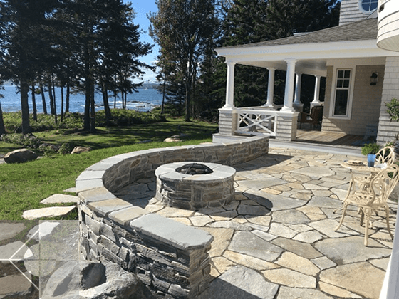 Sweeping curved terrace design with gas fire pit landcaping by Phelps Architects.