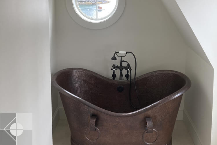 Unique bathroom sink with round window.