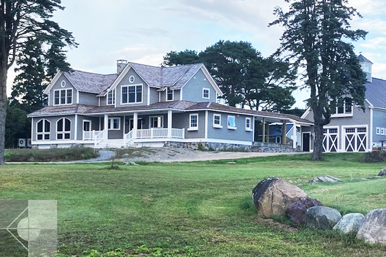 Cottage style new construction that blends Fraftsman and Shingle Style architectural detailing.