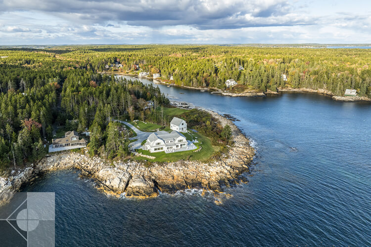Aerial view showing this house is surrounded by ocean on three sides.