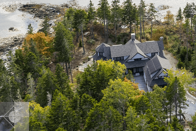 St. George, Maine home surrounded by trees and ocean.