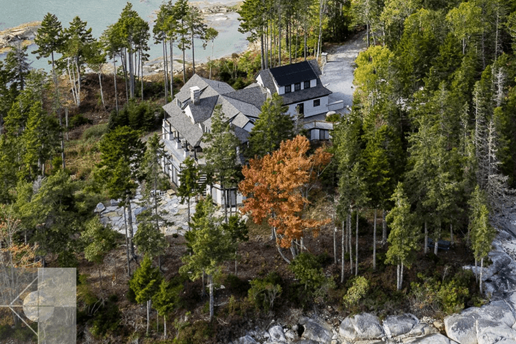 House with fieldstone patieo and driveway.
